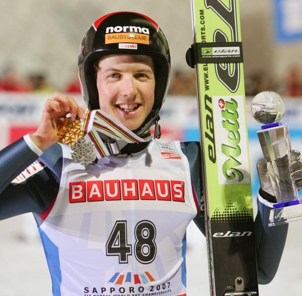 Simon Ammann of Switzerland shows his medals for the press after an  award ceremony of the ski jumping  normal hill individual competition  in the World Nordic Ski Championships in Sapporo, northern Japan, 03  March 2007. Gold medalist of the large hill ski jumping individual  competition, Simon Ammann captured silver mendal in the event